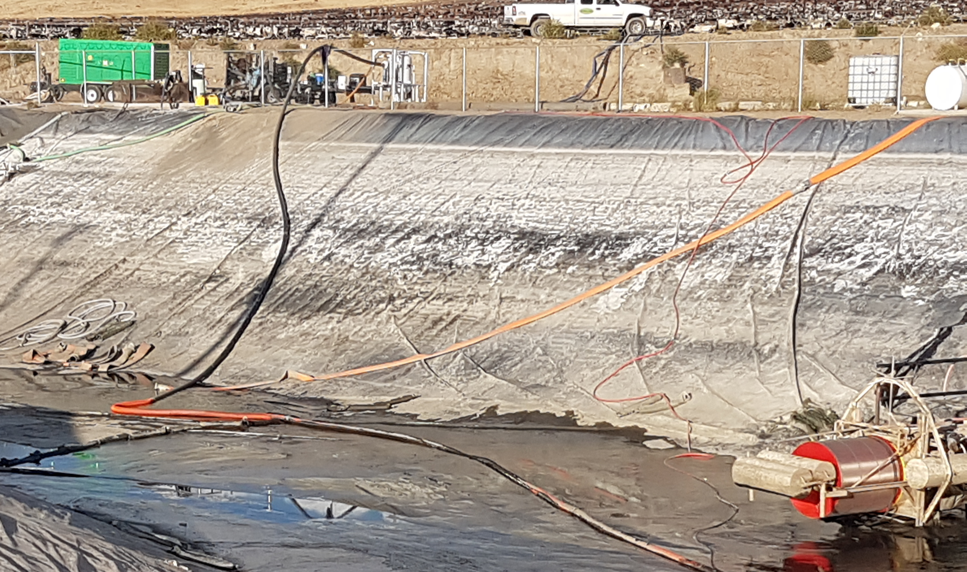 PV500 pumping waste water from holding pond with cattle in background