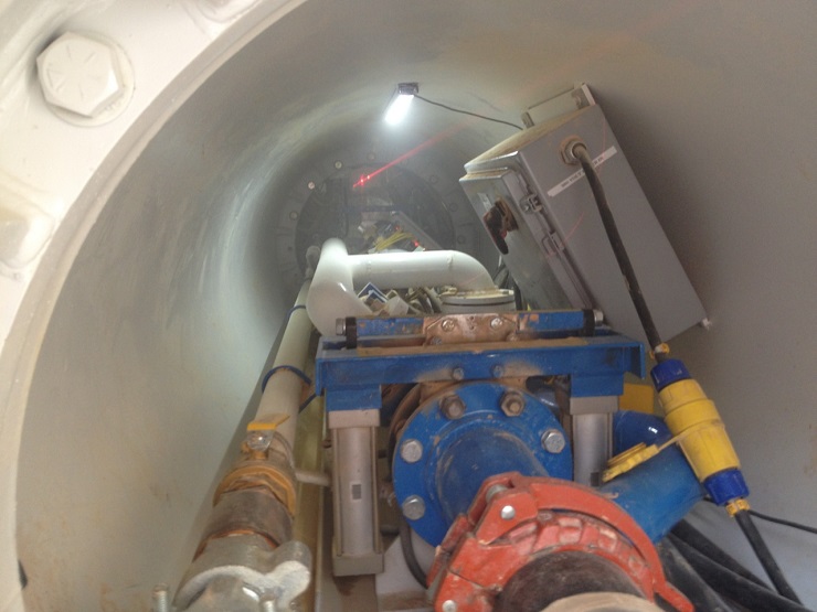 IVAC material transfer system in tunnel with visible laser level