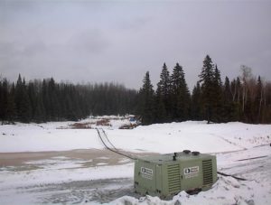 air compressor and steel pipe at winter work site