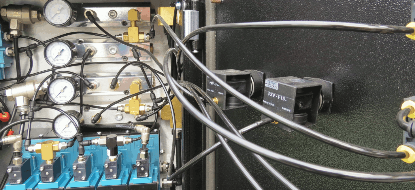 pneumatic control panel showing gauges and air hose 